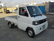 It is a picture of the white mitsubishi minicab  truck in 2001,First Photo Stock No.Y035001