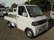 It is a picture of the white mitsubishi minicab  truck in 2002,First Photo Stock No.Y035060