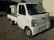 It is a picture of the white suzuki carry truck in 2006,First Photo Stock No.Y035401