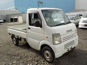 It is a picture of the white suzuki carry truck in 2007,First Photo Stock No.Y035514