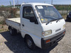 It is a picture of the white suzuki carry truck in 1993,Sub Photo 0 Stock No.Y036045
