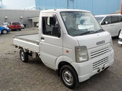 It is a picture of the white suzuki carry truck in 2007,First Photo Stock No.Y036589