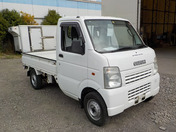 It is a picture of the white suzuki carry truck in 2003,First Photo Stock No.Y036701