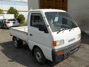 It is a picture of the white suzuki carry truck in 1996,First Photo Stock No.Y036939