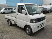 It is a picture of the white mitsubishi minicab truck in 2003,First Photo Stock No.Y037008