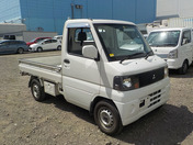It is a picture of the white mitsubishi minicab truck in 2003,First Photo Stock No.Y037282