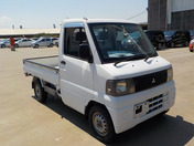 It is a picture of the white mitsubishi minicab  truck in 2001,First Photo Stock No.Y038204