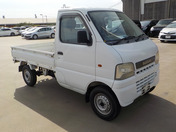 It is a picture of the white suzuki carry truck in 2001,First Photo Stock No.Y038245