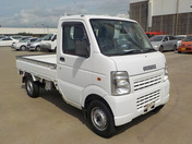 It is a picture of the white suzuki carry  truck in 2002,First Photo Stock No.Y038329