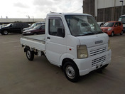 It is a picture of the white suzuki carry truck in 2003,First Photo Stock No.Y038634