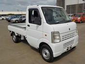 It is a picture of the white suzuki carry truck in 2009,First Photo Stock No.Y039582
