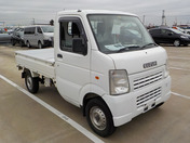 It is a picture of the white suzuki carry truck in 2009,First Photo Stock No.Y040051