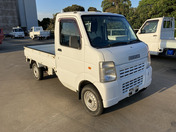It is a picture of the white suzuki carry truck in 2006,First Photo Stock No.Y040098