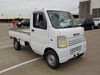 It is a picture of the white suzuki carry truck in 2003,Sub Photo 0 Stock No.Y040285
