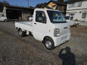 It is a picture of the white suzuki carry truck in 2006,First Photo Stock No.Y041962