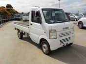 It is a picture of the white suzuki carry truck in 2009,First Photo Stock No.Y042817