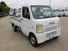It is a picture of the white suzuki carry truck in 2002,Sub Photo 0 Stock No.Y043219