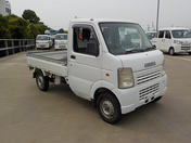 It is a picture of the white suzuki carry truck in 2006,First Photo Stock No.Y043489