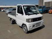 It is a picture of the white mitsubishi minicab truck in 2003,First Photo Stock No.Y043576
