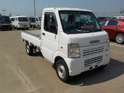 It is a picture of the white suzuki carry truck in 2004,First Photo Stock No.Y044023