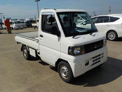 It is a picture of the white mitsubishi minicab truck in 2009,First Photo Stock No.Y046265