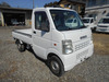 It is a picture of the white suzuki carry truck in 2004,Sub Photo 0 Stock No.Y048358