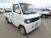 It is a picture of the white mitsubishi minicab truck in 2004,First Photo Stock No.Y048978